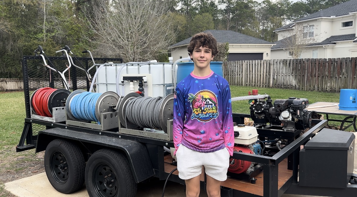 Kolby Meyer standing in front of the St Johns ProWash rig